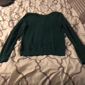 A green sweater